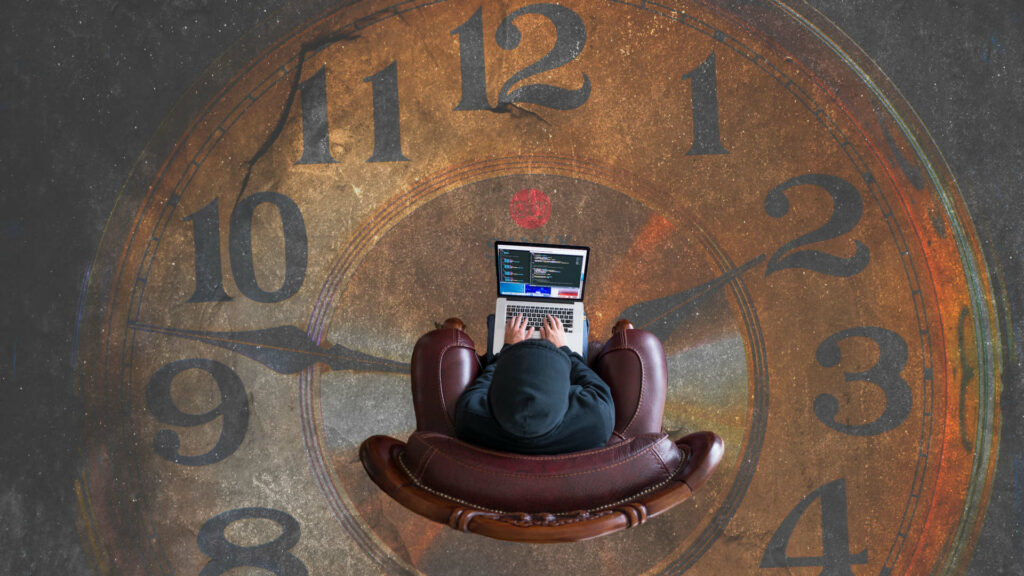 Man sitzt auf Uhr und arbeitet