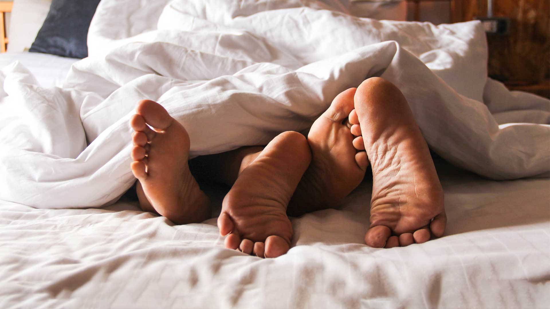 Füße im Bett, Menschen die Sex haben